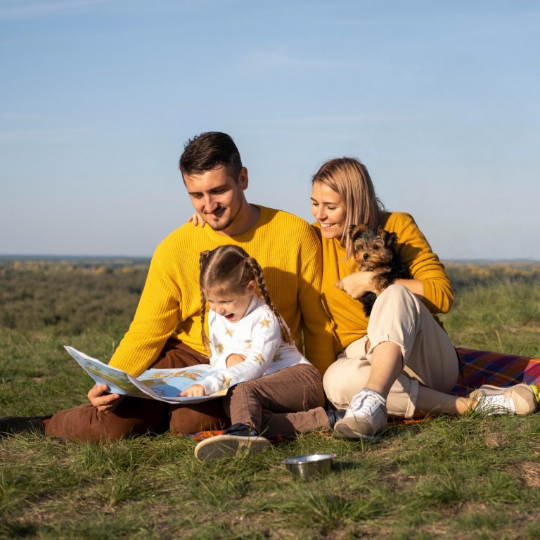 Happy Family sitting in a grassfield